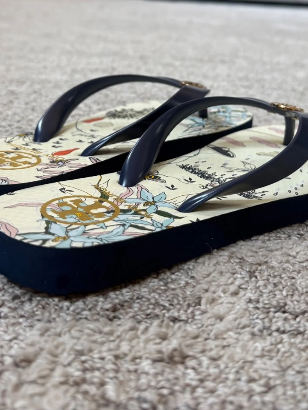 Tory Burch navy “poetry of things” flip flops, size 7 1/2